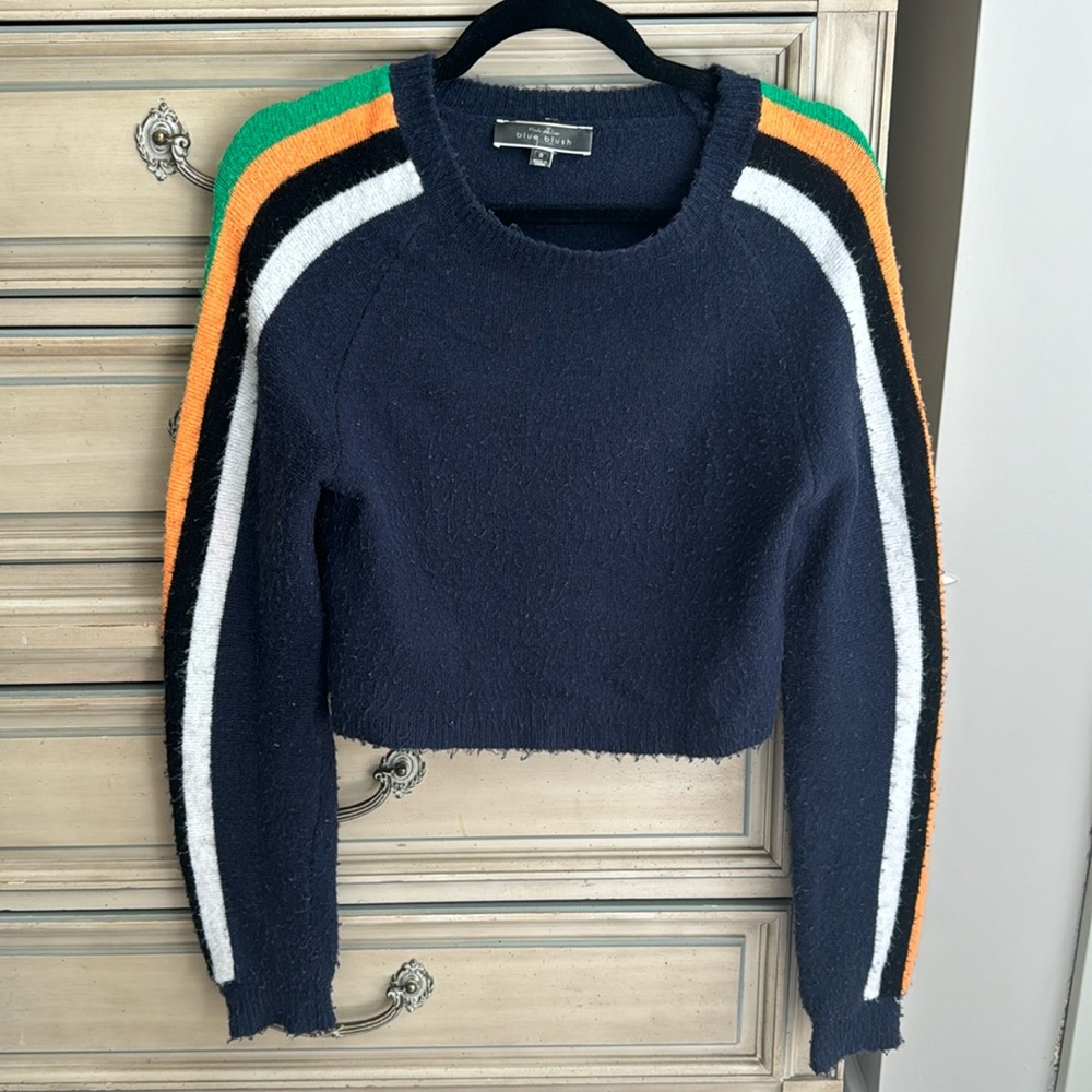 Cropped navy sweater with orange/green/red/white/black stripes down arm